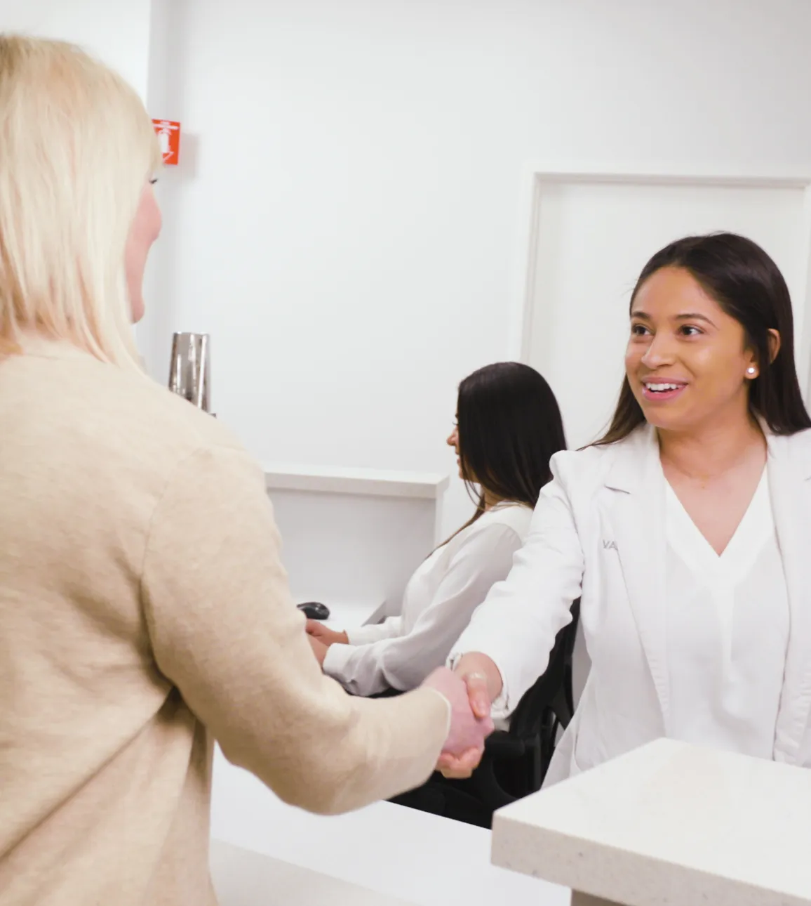 Front desk greeting patient